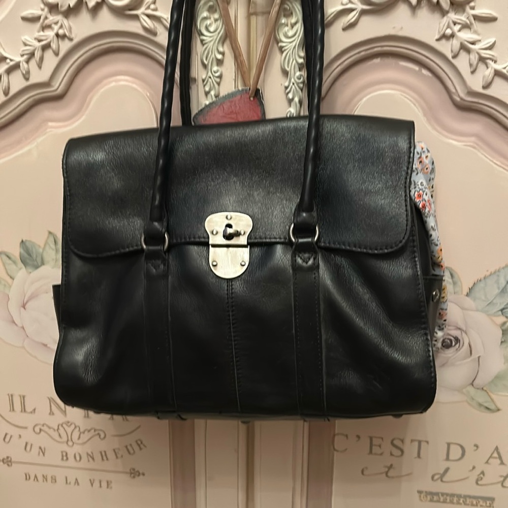 Jet black satchel by Patricia Nash all leather feet on bottom great condition